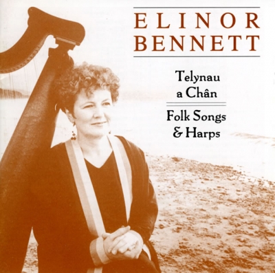 A sepia portrait of a seated woman beside a large harp, with a pale open shoreline behind her and album lettering above to the right.