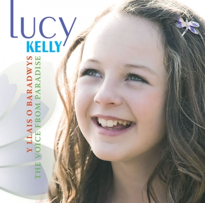 A smiling young girl with long brown hair and a purple flower looks upwards beside blue and turquoise lettering on a bright cover.